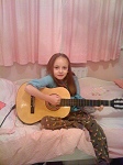 Daisy playing guitar